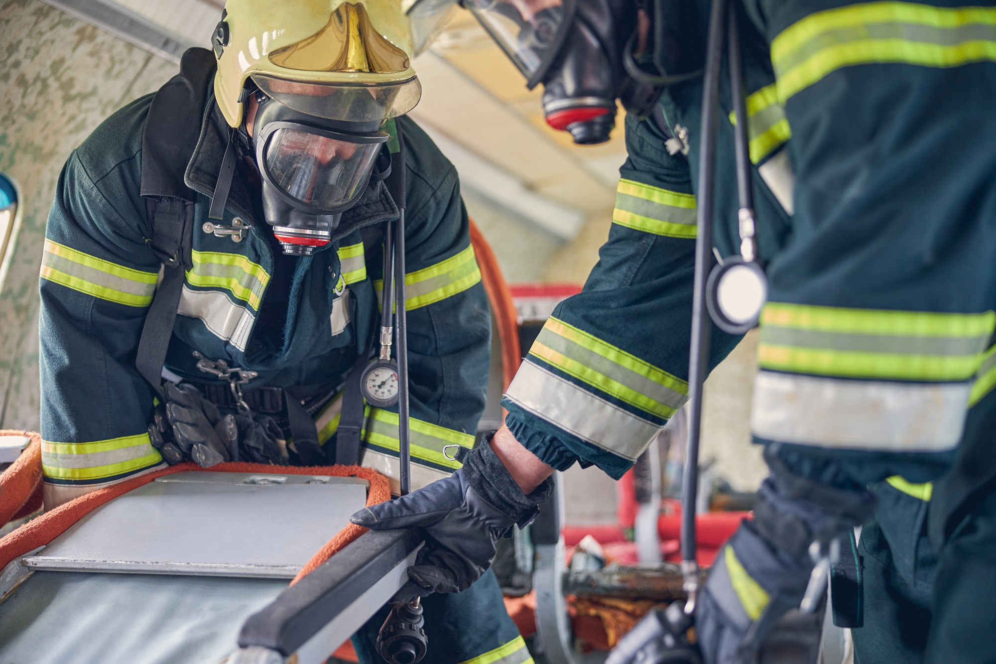 Emergency response personnel working in protective equipment