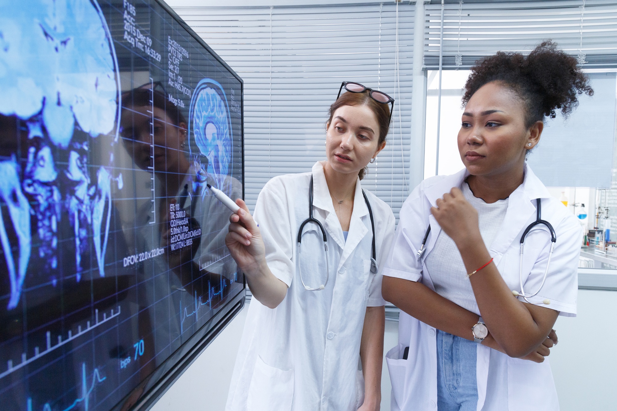 Healthcare team reviewing medical imaging and clinical data